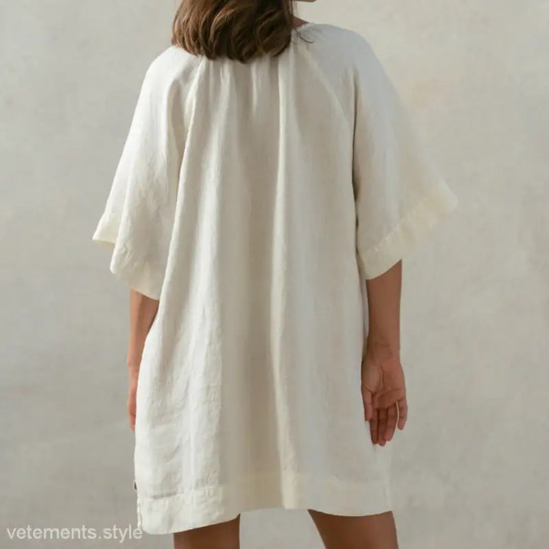 Loose-fitting off-white soft cotton nightdress with tie sleeves and pockets in apricot