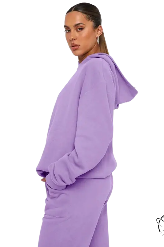 Woman in lavender hooded long sleeve sweater with soft touch trousers