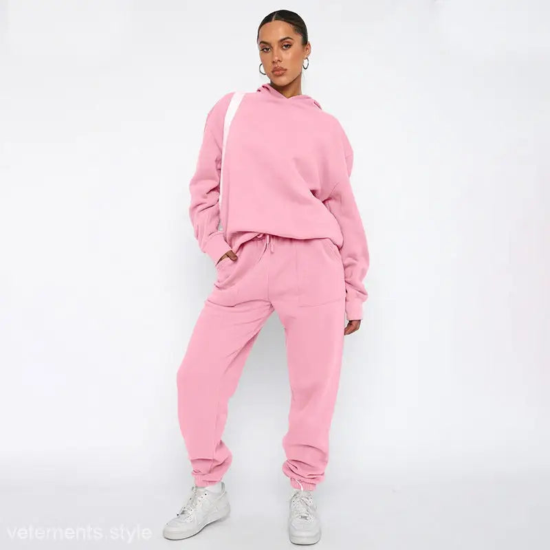 Pink sweatsuit with soft touch trousers and warm comfortable long sleeve sweater, white sneakers