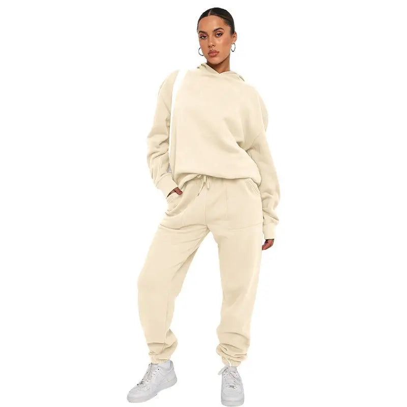 Woman wearing soft touch trousers and warm comfortable long sleeve sweater with white sneakers