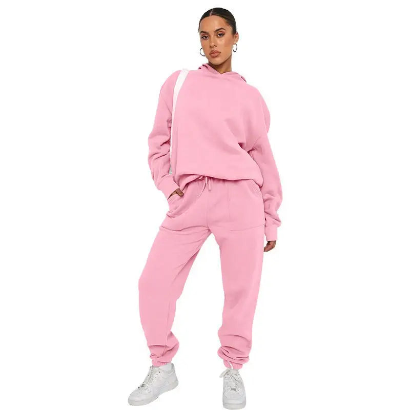Pink sweatsuit with soft touch trousers and warm comfortable long sleeve sweater, white sneakers