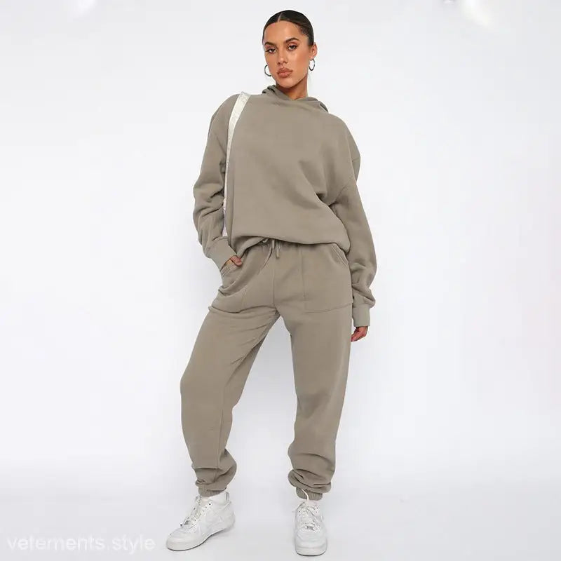 Woman wearing soft touch trousers and warm comfortable long sleeve sweater with white sneakers