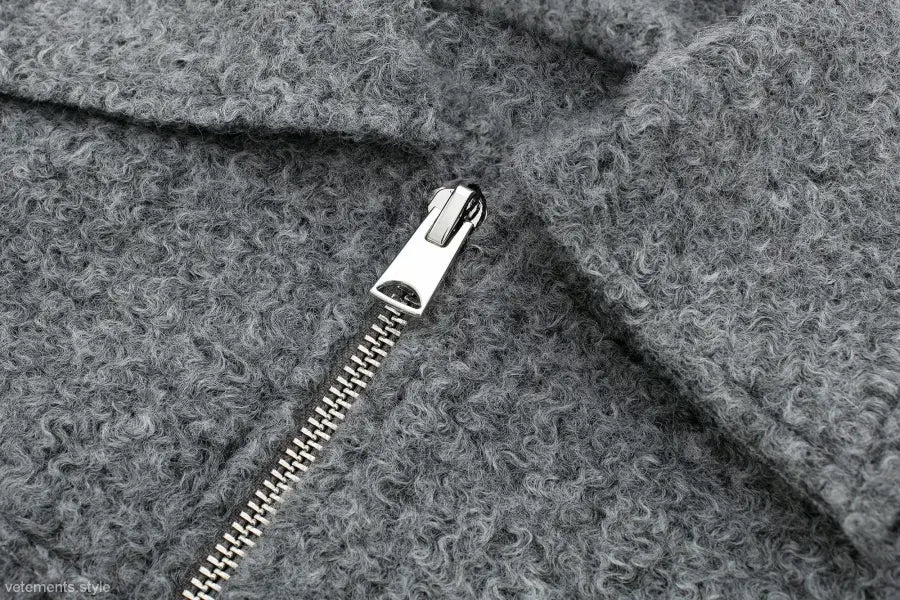 Metal zipper on gray woolen fabric of Soft Tweed Jacket with winter polo collar