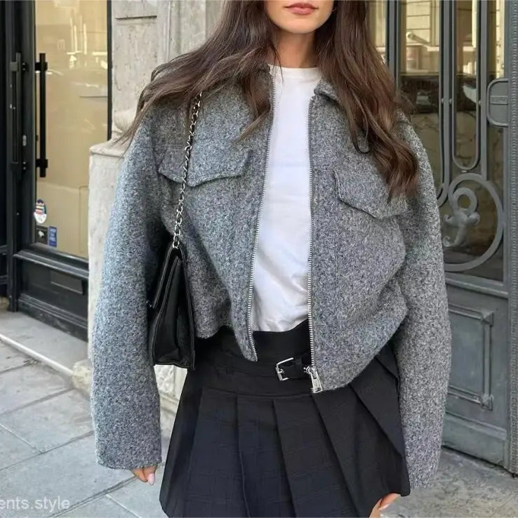 Gray wool cropped soft tweed jacket with winter polo collar over white top and black skirt