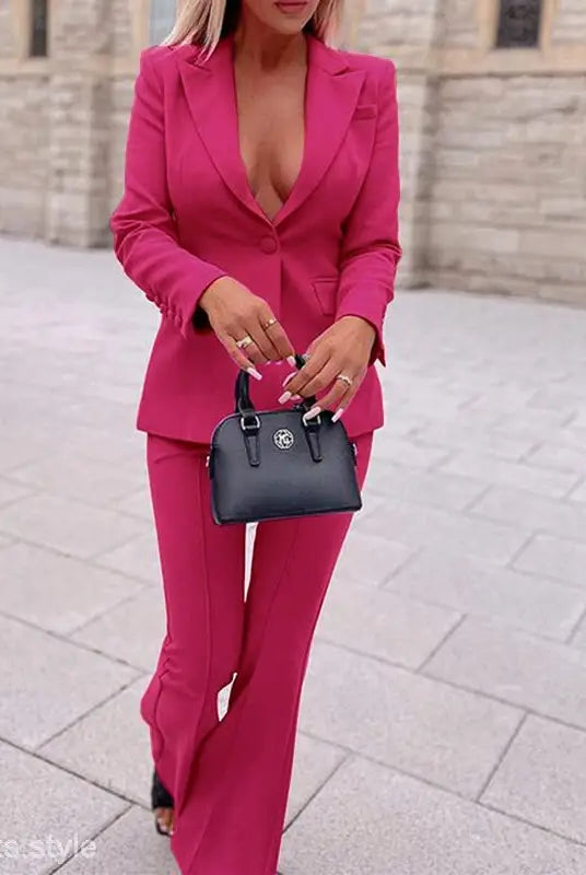 Vibrant hot pink women’s pantsuit for candy business wear with flared trousers