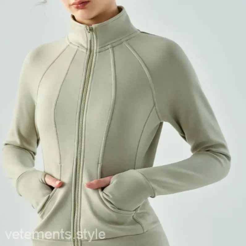 Beige zip-up athletic jacket with contoured seams and high collar in linen green and Haiyan Ash air layer coat