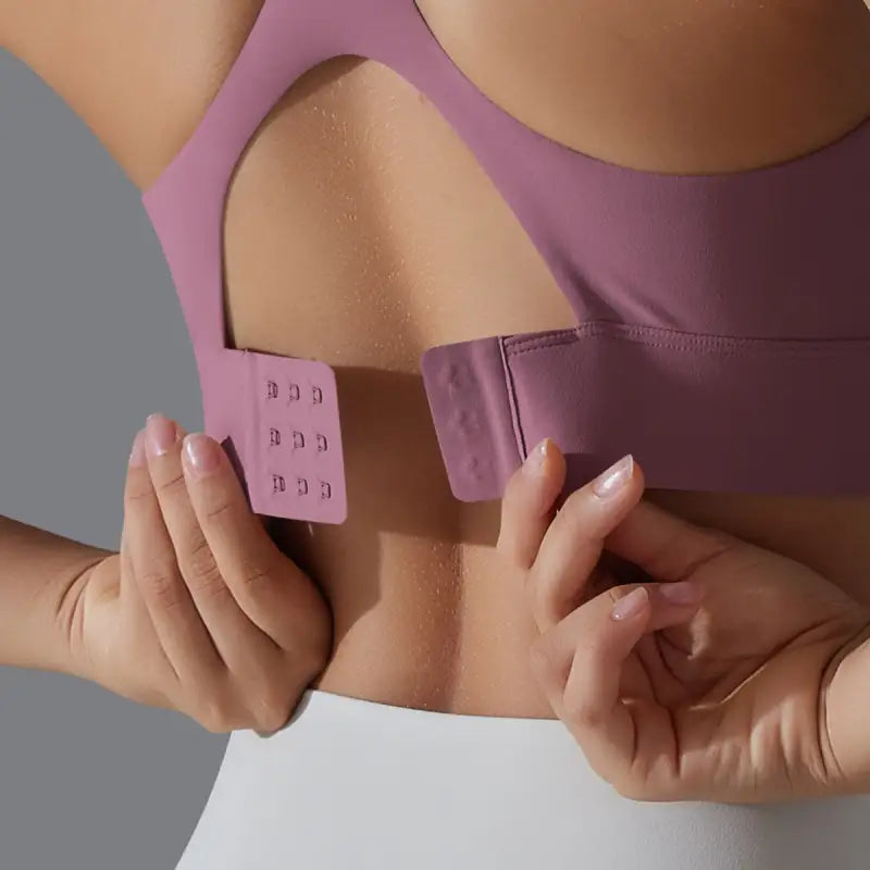 Purple sports bra with adjustable hook-and-eye closure for Sporty Backless Yoga Vest