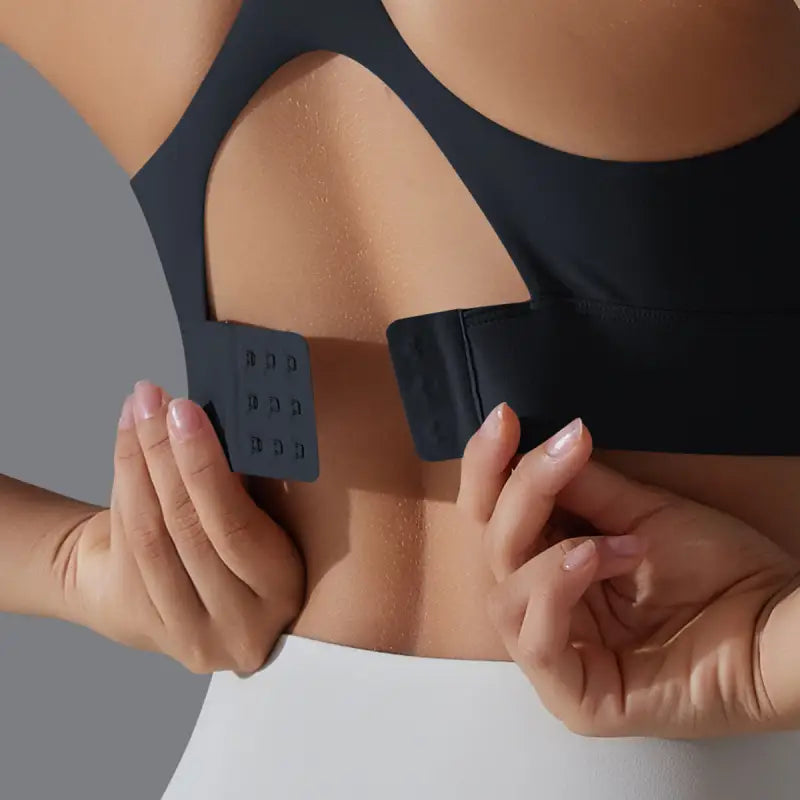 Sports bra with adjustable hook-and-eye closure on Sporty Backless Yoga Vest with cutout back