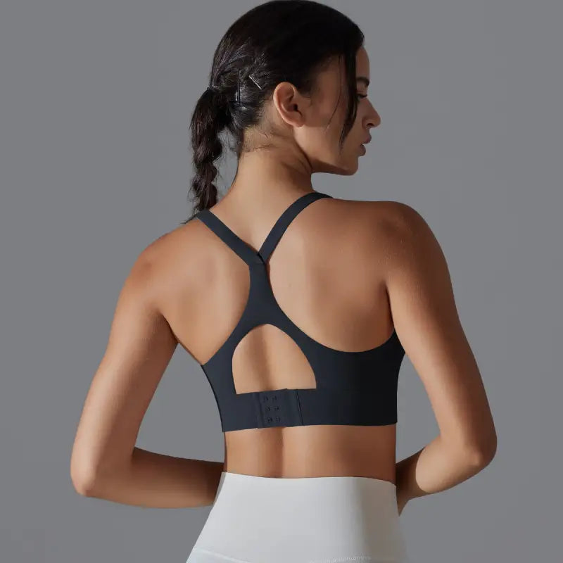 Sporty backless yoga vest with cutout back and crossback design, ideal for yoga and fitness
