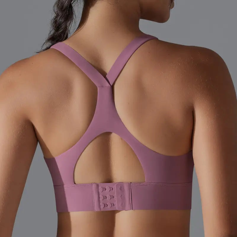 Purple sports bra with racerback design and adjustable hook, ideal for backless yoga vest practice
