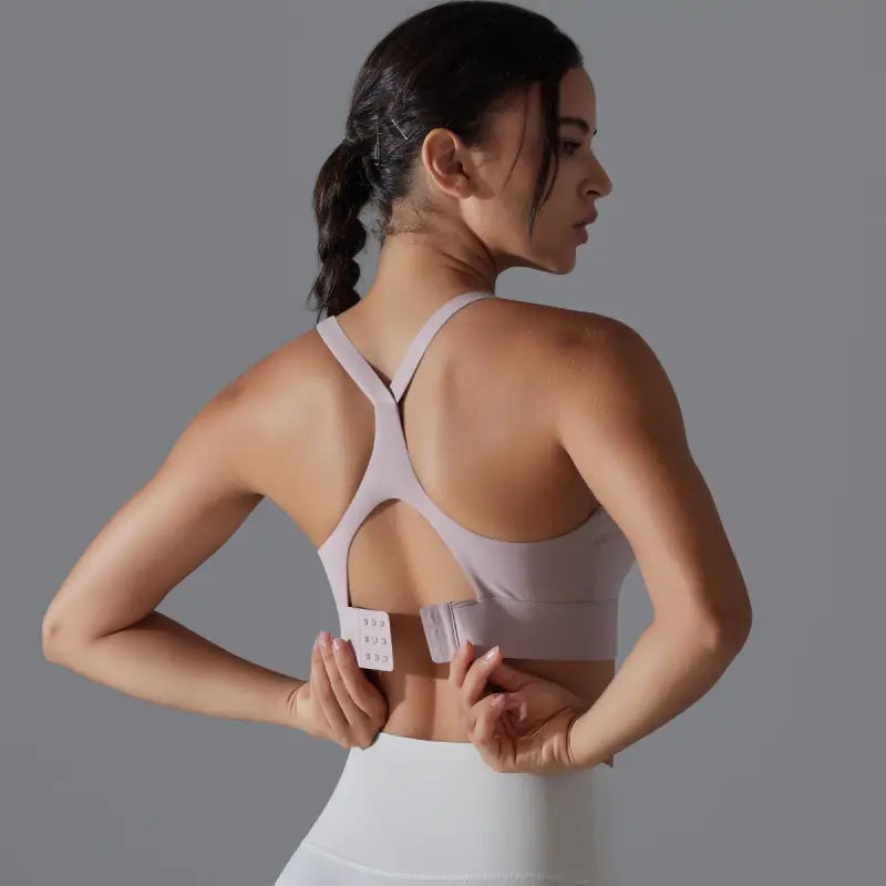 Backless yoga vest with racerback design and adjustable hook closure for activewear