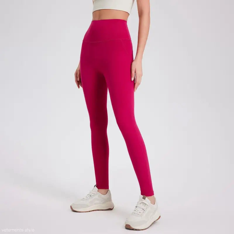 Wild berry color sporty high-rise nylon pants with white sneakers