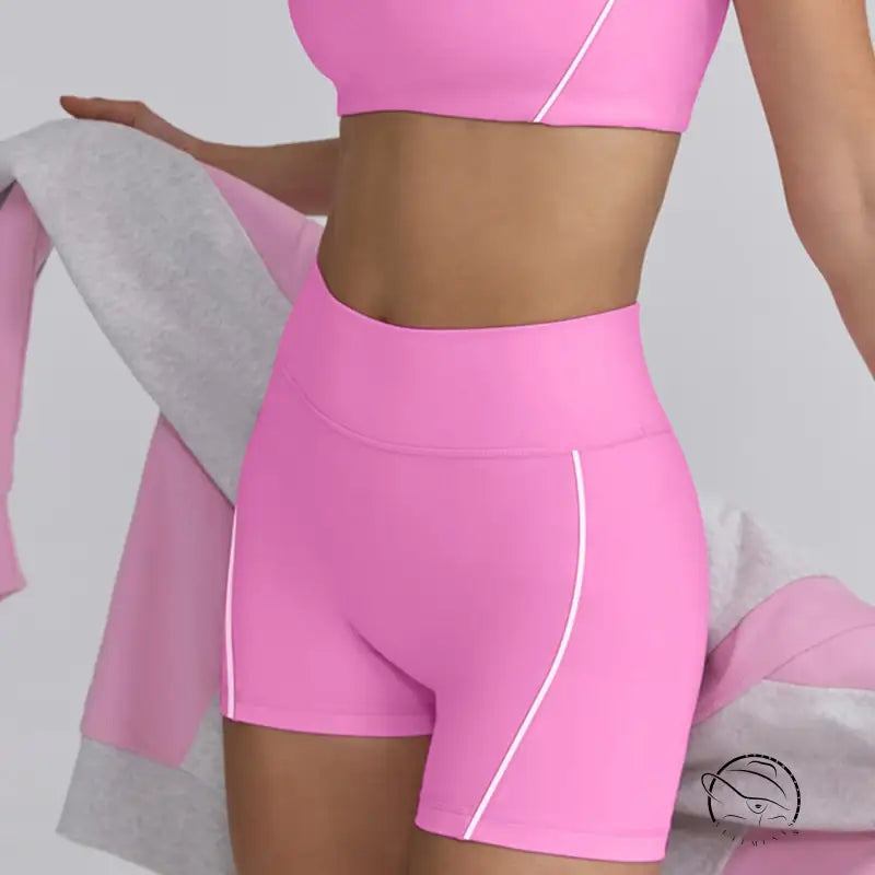 Bright pink summer yoga clothes set with crop top and high-waisted shorts