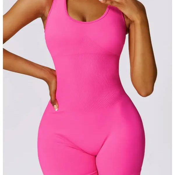 Form-fitting pink romper featured with Sporty High Rise Nylon Shorts in Volcanic Ash