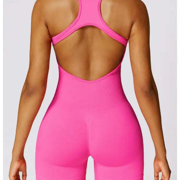 Pink Yoga Bodysuit paired with Sporty High Rise Nylon Shorts in Volcanic Ash