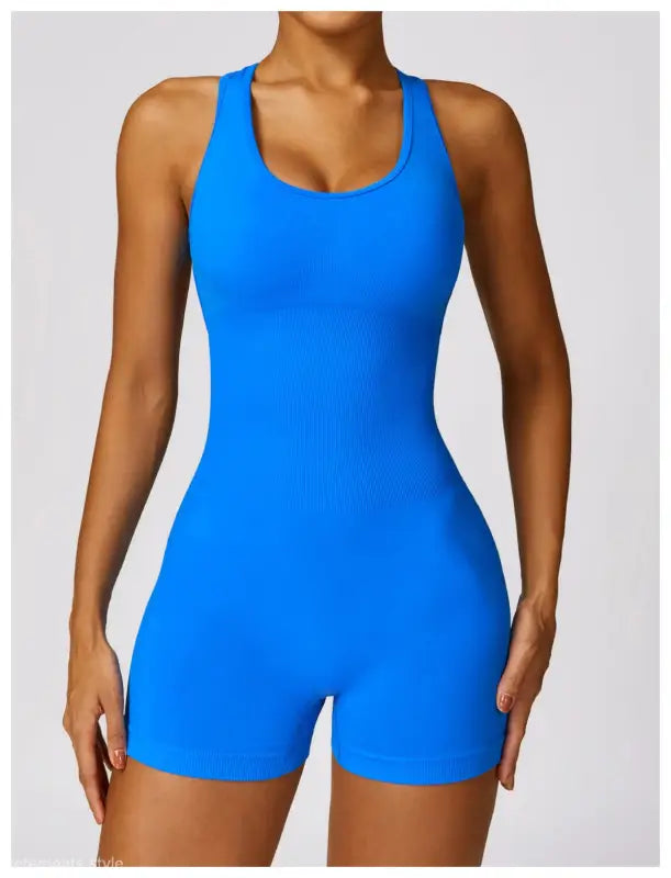 Blue racerback bodysuit paired with Volcanic Ash Sporty High Rise Nylon Shorts