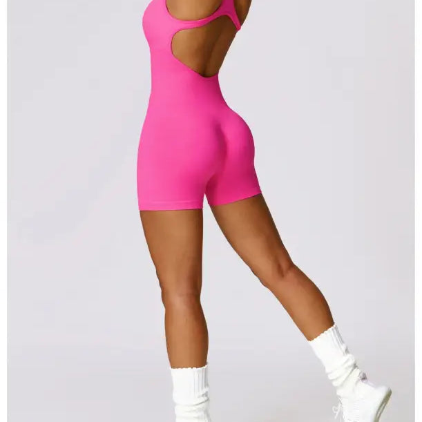 Pink athletic romper with open back from Sporty High Rise Nylon Shorts in Volcanic Ash