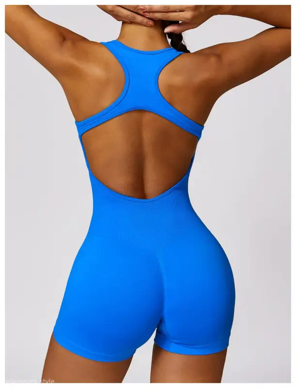 Blue athletic romper designed for active wear, featuring a comfortable fit in Volcanic Ash