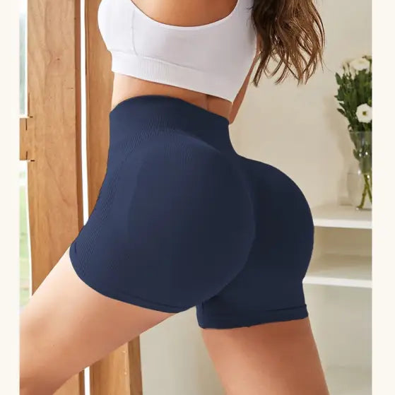 Navy blue sexy quick drying tight fitness pants on a model’s lower body