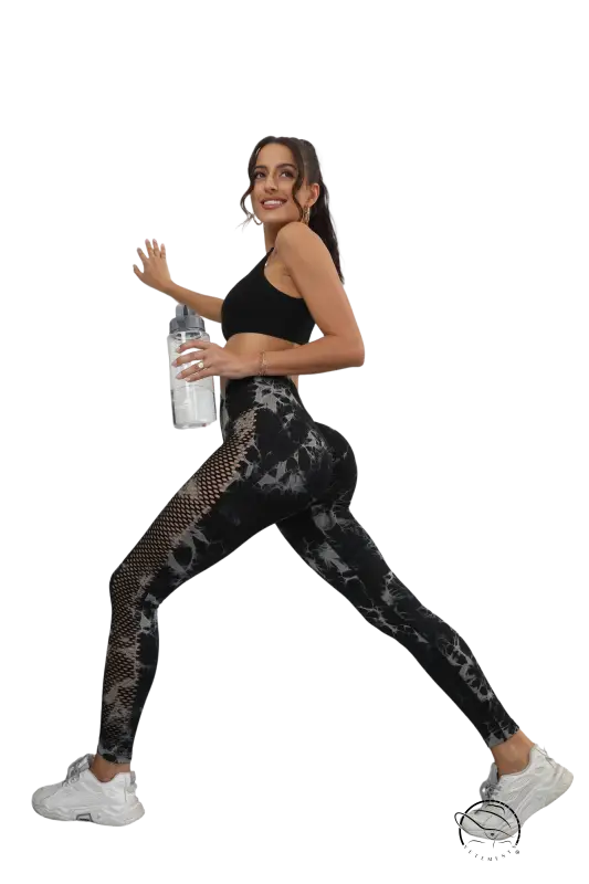 Woman in black tie-dye high-rise fitness pants for running