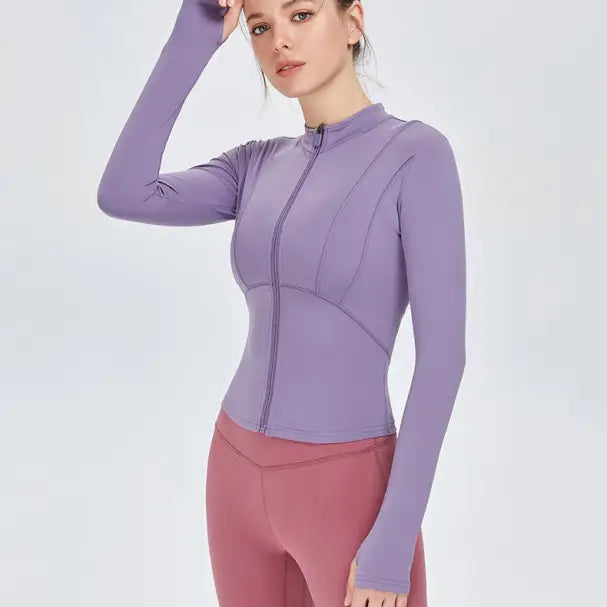 Woman in purple athletic jacket and pink leggings wearing Sporty Long Sleeve Nylon Tee Phantom Black or Dark Gray Purple