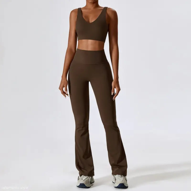 Brown two-piece athletic set with sports bra and flared yoga pants in camel brown