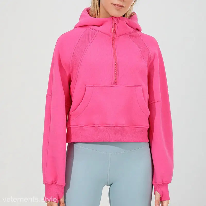 Bright pink cropped hoodie with half-zip front for morning running warm workouts
