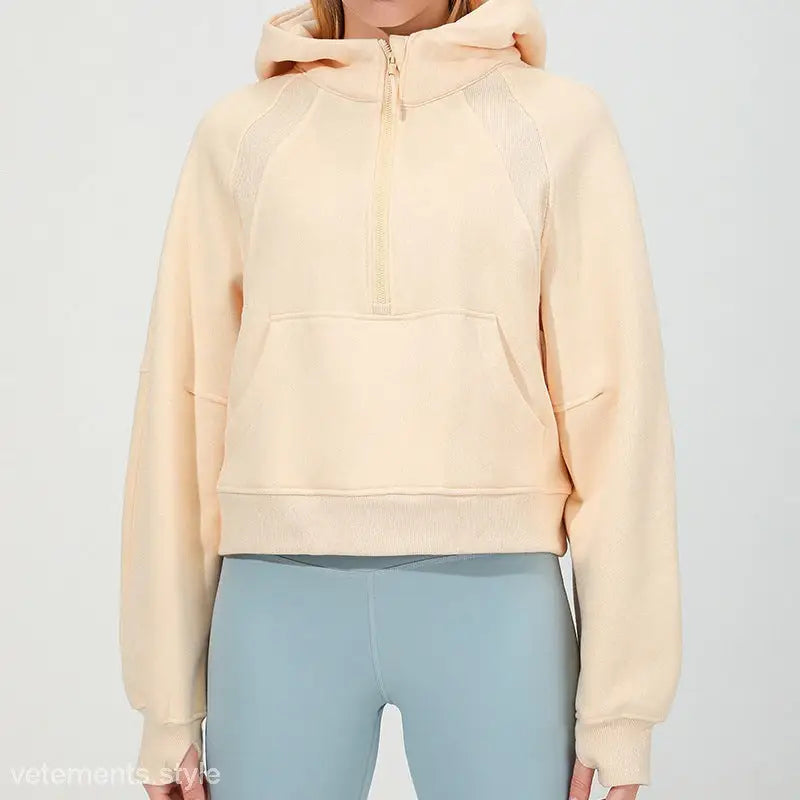 Cream-colored hooded sweatshirt with half-zip front for morning running warm workouts