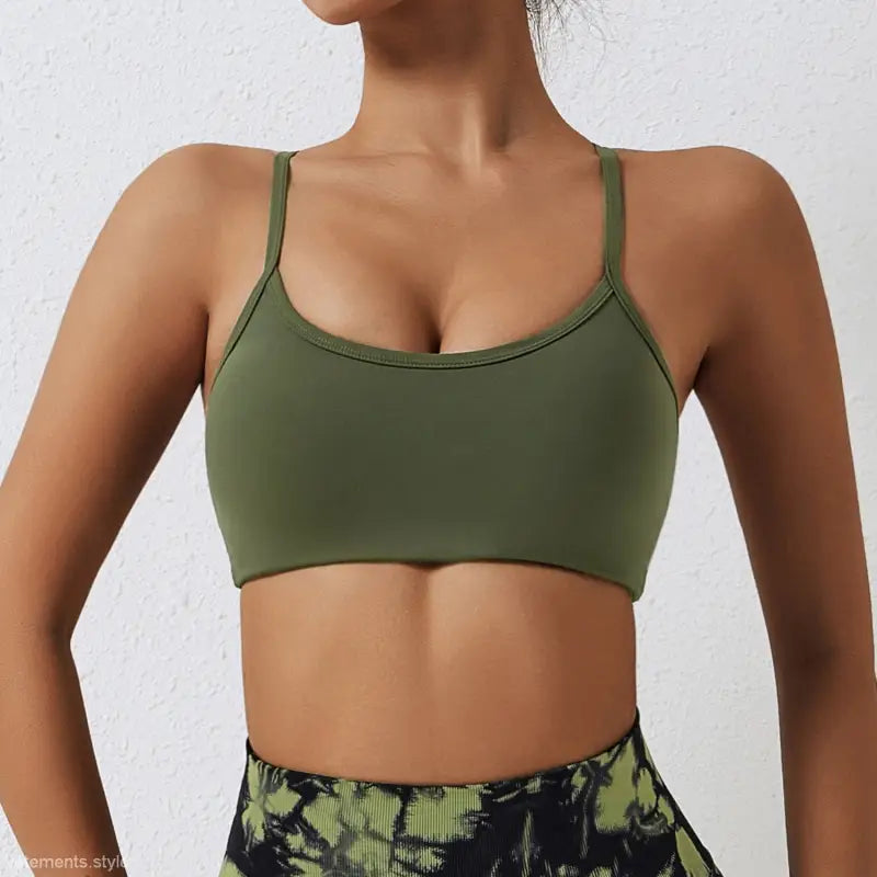 Olive green sports bra with thin straps and scoop neckline from Sporty Nylon Cutout Back Strap in advanced black and fluorescent orange