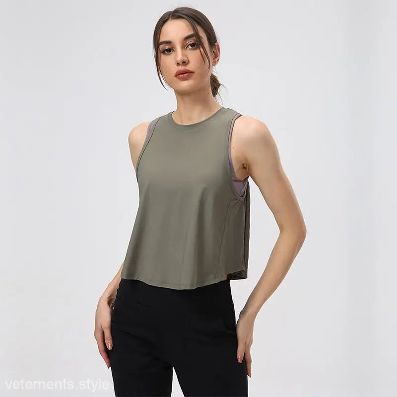 Woman wearing a sleeveless Chinese Olive Green and Midnight Blue Half Waist Blouse