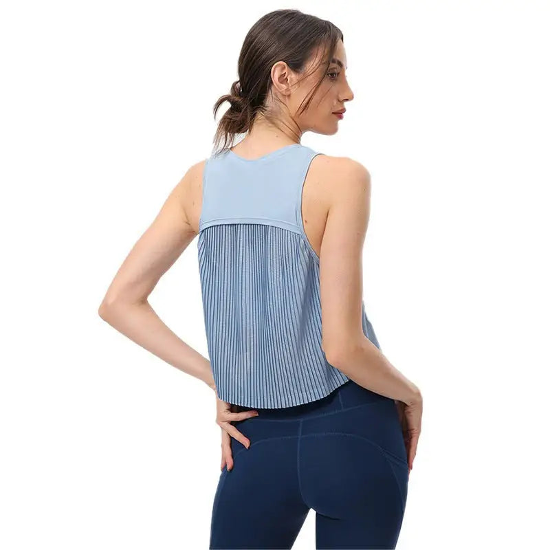 Light blue sleeveless half waist blouse with pleated back panel in Chinese Olive Green and Midnight Blue