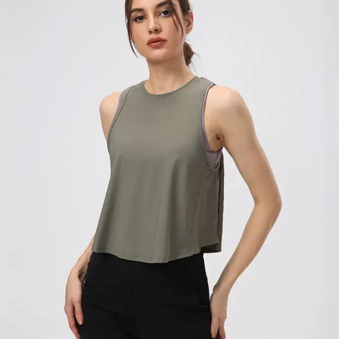 Sleeveless Chinese Olive Green Half Waist Blouse paired with Black Pants and Midnight Blue accents