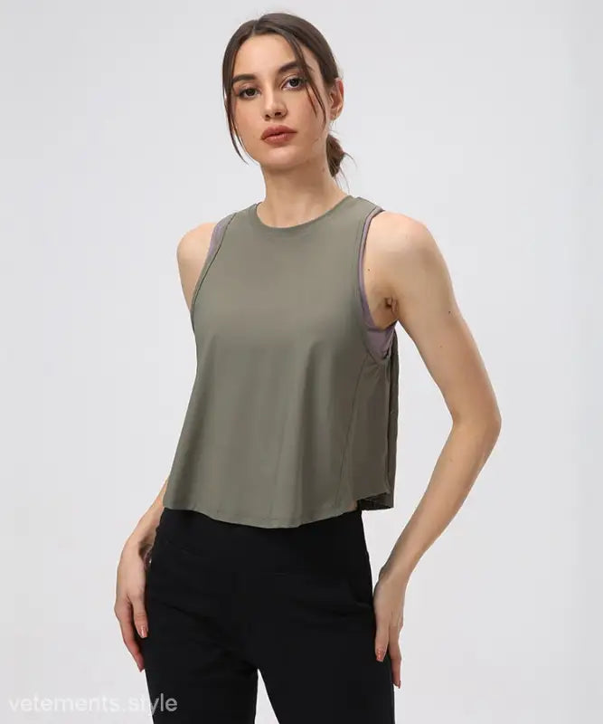 Sleeveless Chinese Olive Green Half Waist Blouse paired with Black Pants and Midnight Blue accents