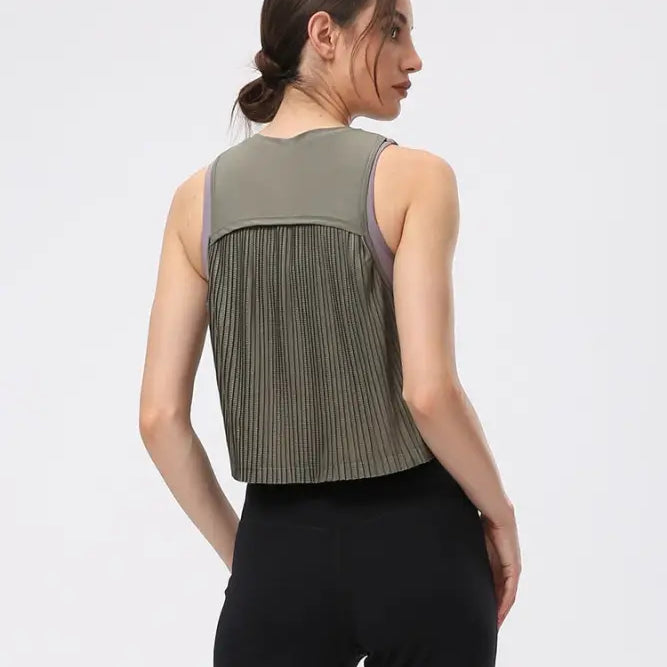 Sleeveless Chinese Olive Green half waist blouse with pleated back paired with black pants
