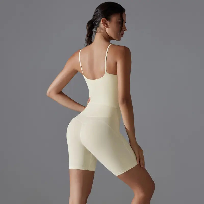 Cream-colored form-fitting bodysuit from summer shorts yoga set for comfortable yoga sessions