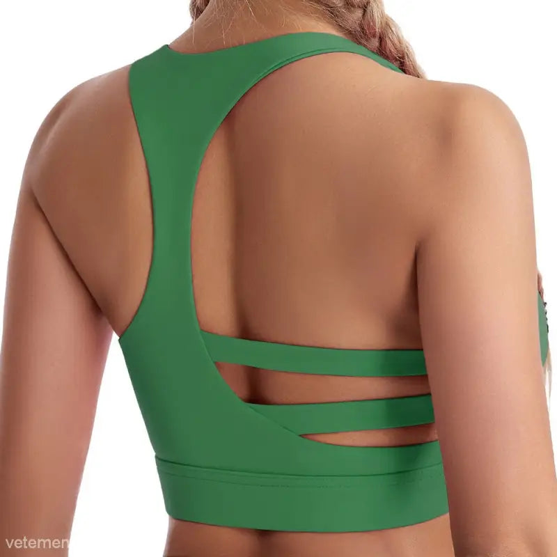 Green workout bra featuring a strappy back and steel ring for boost shape support