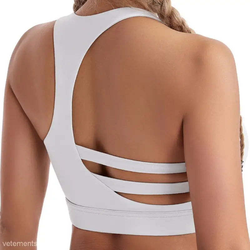White sports bra with strap details for the Sporty Nylon Solid Cutout Back Boost Shape Bra