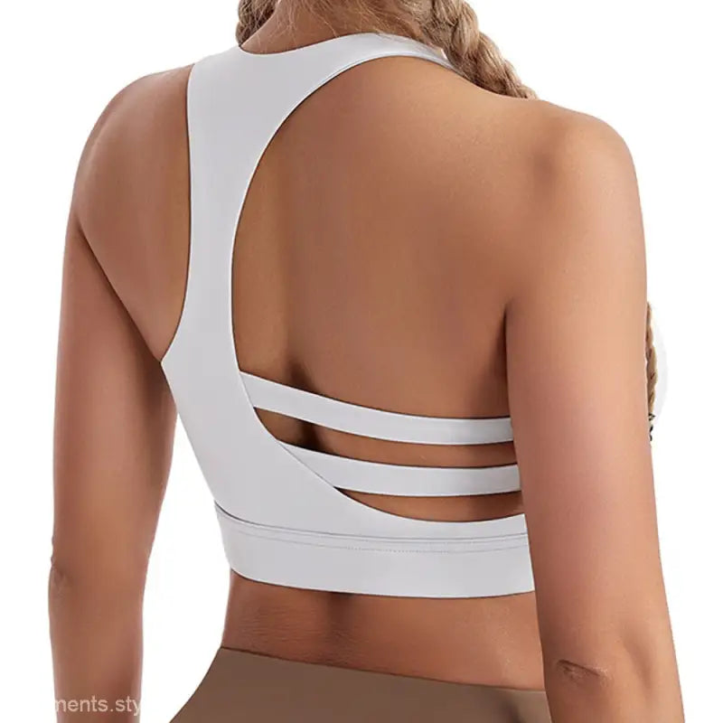 White strappy back sports bra featuring steel ring design, ideal boost shape workout bra