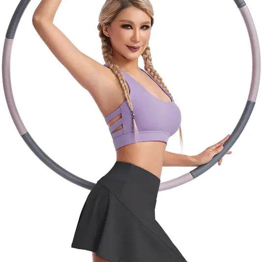 Woman demonstrating fitness with a hula hoop wearing a boost shape workout bra with steel ring