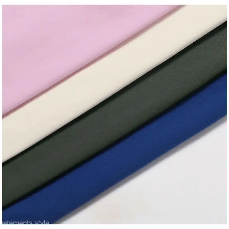 Diagonal fabric strips in pink, cream, dark gray green, and night sky blue for Sporty Nylon Solid Pants