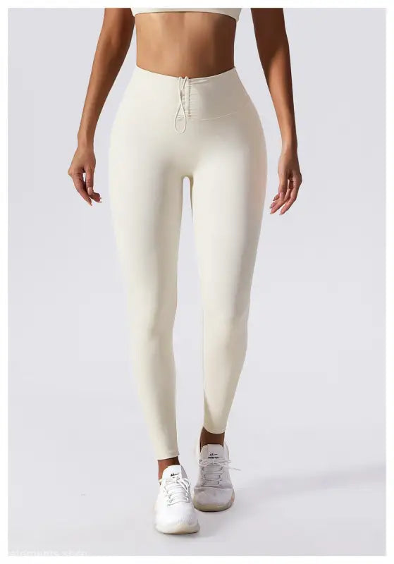 Cream-colored high-waisted leggings with drawstring waistband for Sporty Nylon Solid Pants