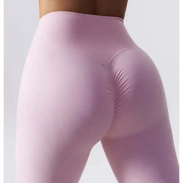 Pink high-waisted seamless workout leggings from Sporty Nylon Solid Pants collection