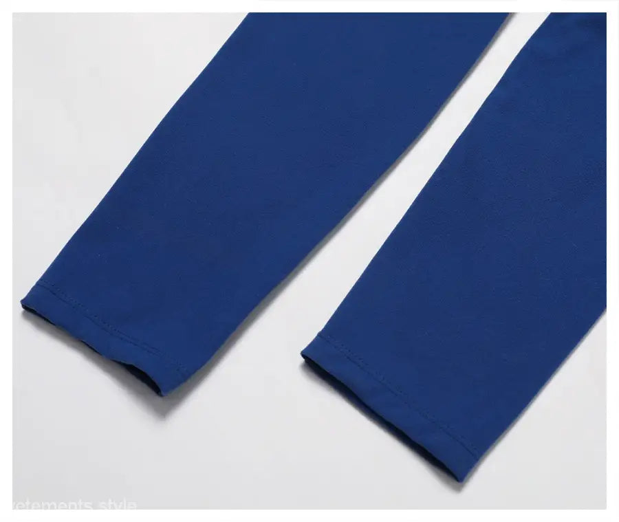 Two blue fabric sleeves from Sporty Nylon Solid Pants in Night Sky Blue