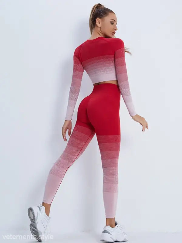 Woman in red ombré workout set with long sleeve top and leggings, stylish activewear