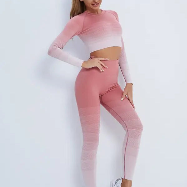 Woman in pink ombre workout set with long sleeve top and high-waisted leggings