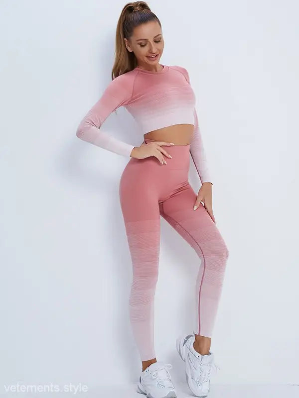 Woman in pink ombre workout set with long sleeve top and high-waisted leggings
