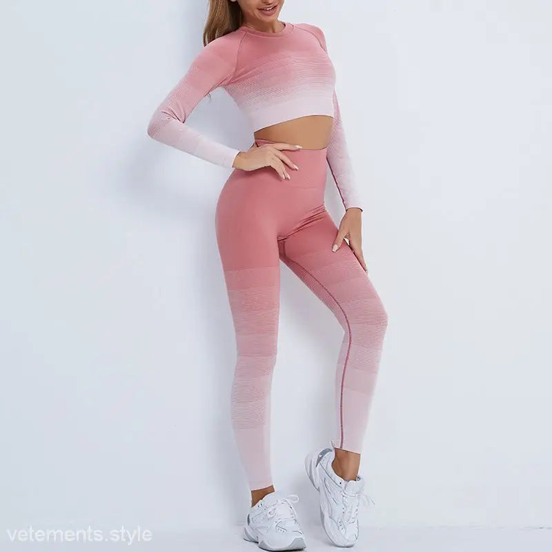 Ombre pink workout set with purple long sleeve crop top and high-waisted leggings