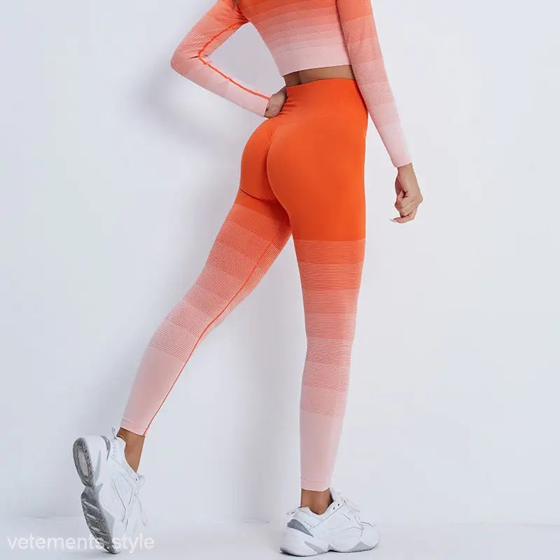 Ombre orange-to-pink athletic leggings with matching top and white sneakers, stylish purple long sleeve outfit