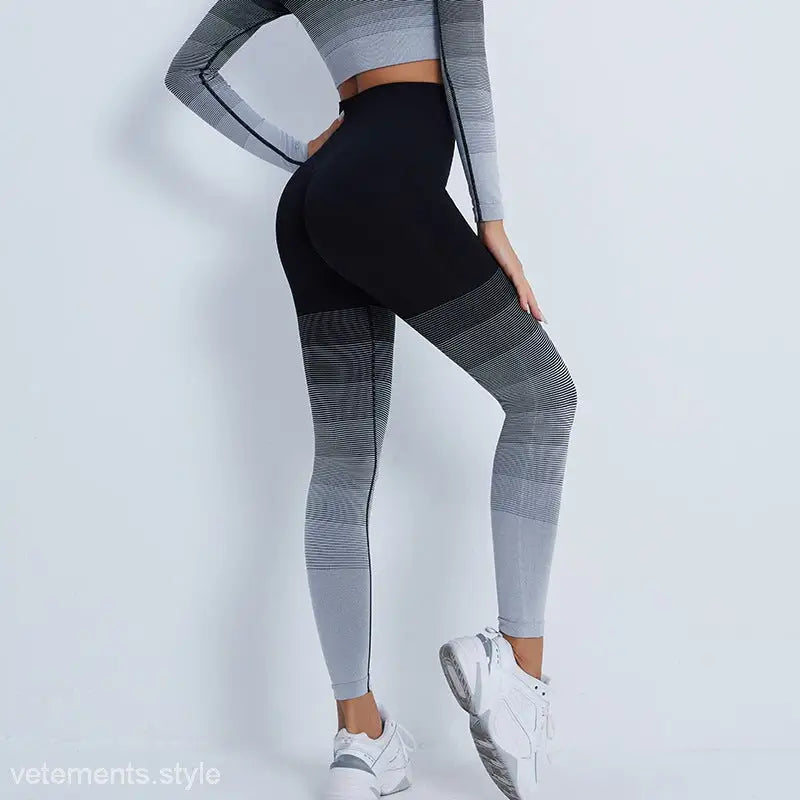 Gradient-patterned athletic leggings with purple long sleeve top and white sneakers for activewear