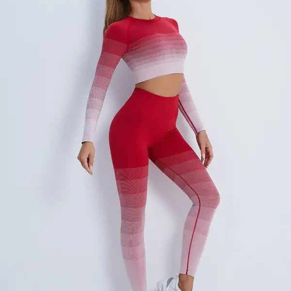Woman in red ombre workout set with white sneakers, highlighting purple long sleeve and orange pink pants